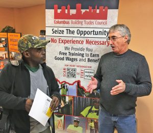 Sheet Metal Worker Local 24 Business Representative Jeff Rush speaks with an attendee at a recent Columbus job fair. If House Bill 98 becomes law, it will give more opportunities for C/COBCTC members to have similar conversations in the region's public high schools.