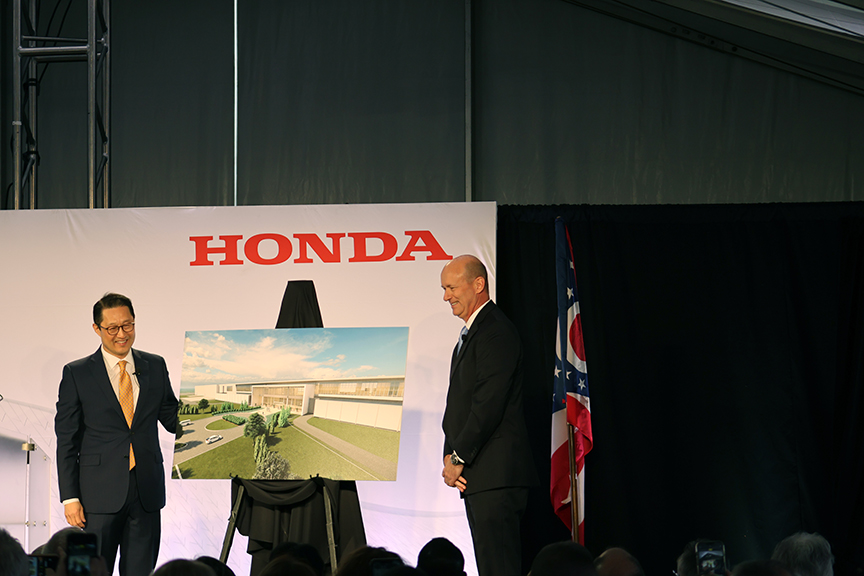 Joint-venture company CEO Robert H. Lee (left) and Rick Riggle, JC company COO (right), unveil the design  of the new $3.5 billion Honda/LG EV Battery Plant. Work on the project will be performed under a PLA by affilaited C/COBCTC members.